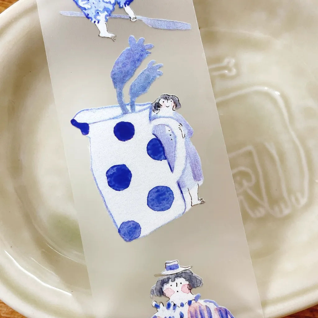 Blue And White PET Tape girl seated beside a patterned clock and floral frame design