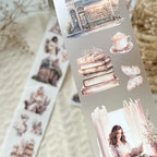 Sheet of decorative stickers with books, coffee, and a woman on a textured surface.