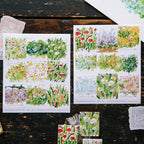 Floral stamps on paper sheets with a wooden surface background