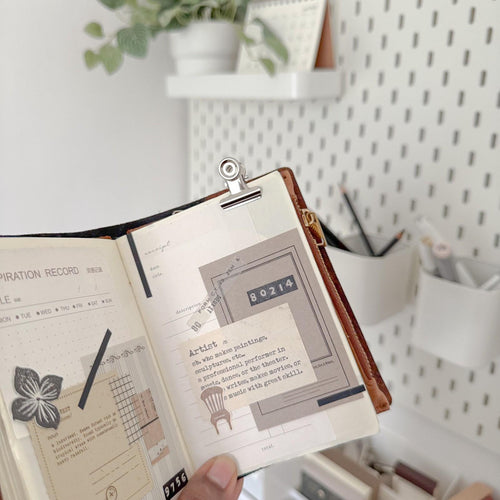 Bulldog Clip Small 2 cm by Avyanna Decore — metal clip holding an illustrated notebook, for journaling