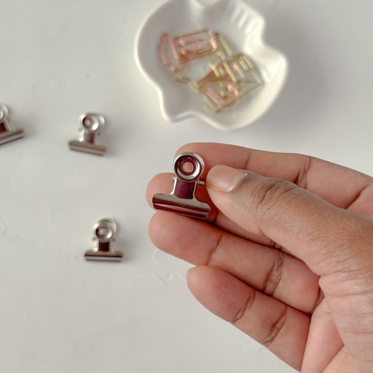 Bulldog Clip Small 2 cm by Avyanna Decore — small metal bulldog binder clip held in hand, for journaling