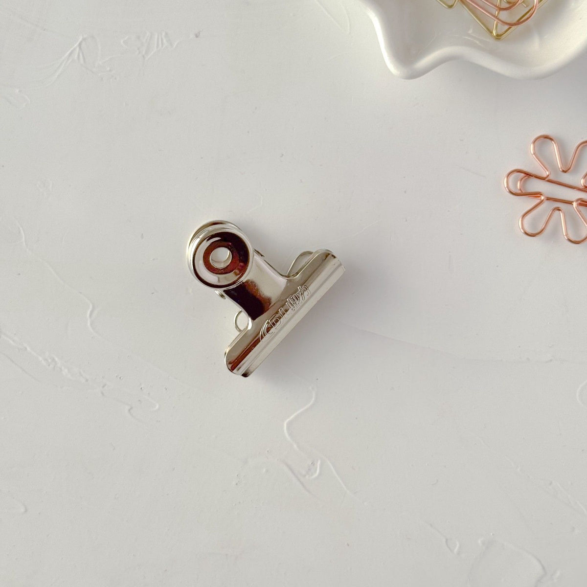 Metallic Medium Bulldog Clip 1.5 inch displayed on its own on a light grey surface