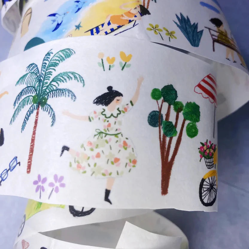 Colorful fabric with illustrations of a woman, palm tree, and bicycle on a white background.