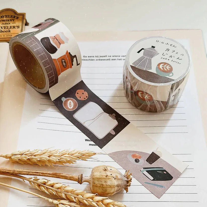 Two rolls of Cafe Sticky Memo Label Sticker Tape on a notebook page with wheat stalks
