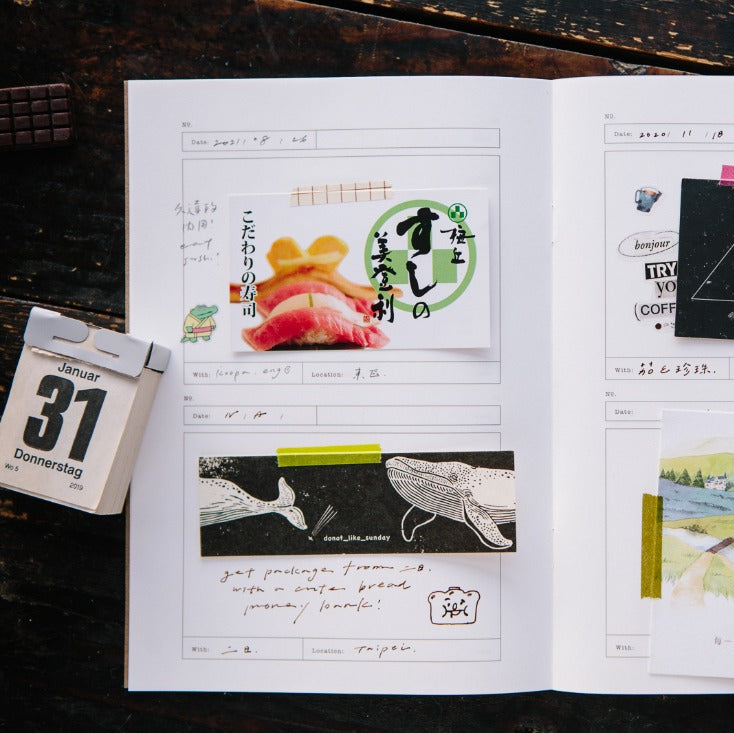 Card Folder Notebook filled with collected images and notes, open on a wooden surface