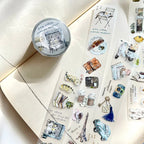 Decorative stickers with illustrations and text on a white surface