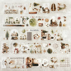 Collection of decorative items including houses, trees, and other ornaments on a textured white background.