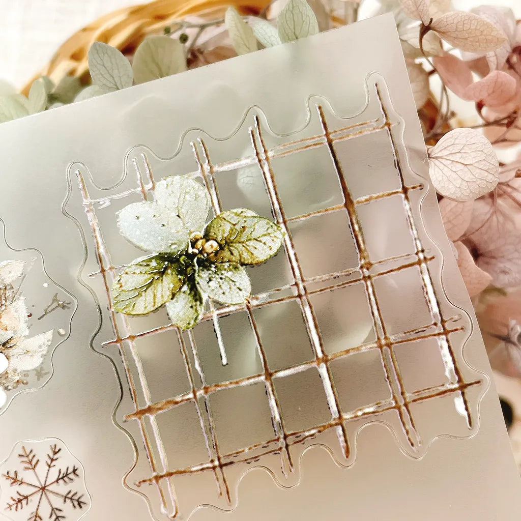 Christmas Wishes PET Tape clear grid design with floral elements on a textured surface