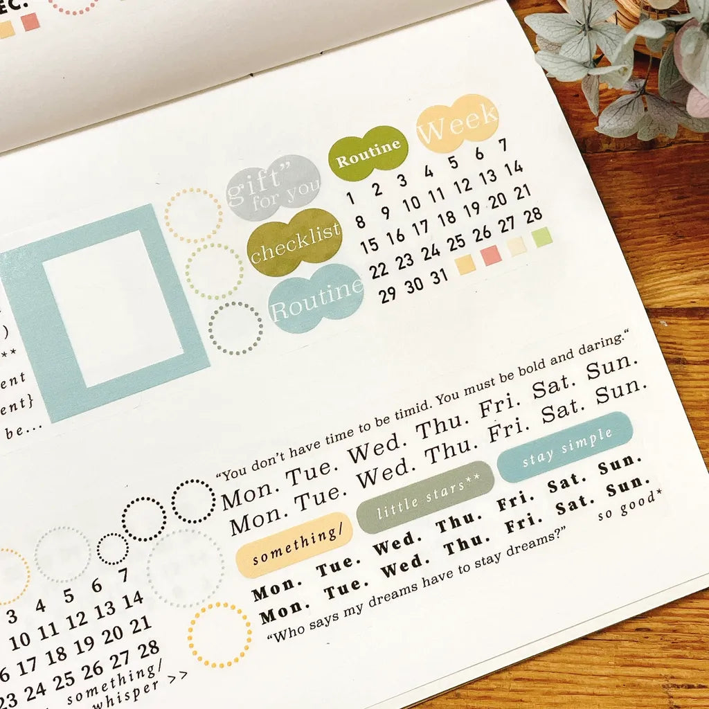 Circle and Frame PET Tape with pastel planner stickers, labels and date designs on a wooden desk