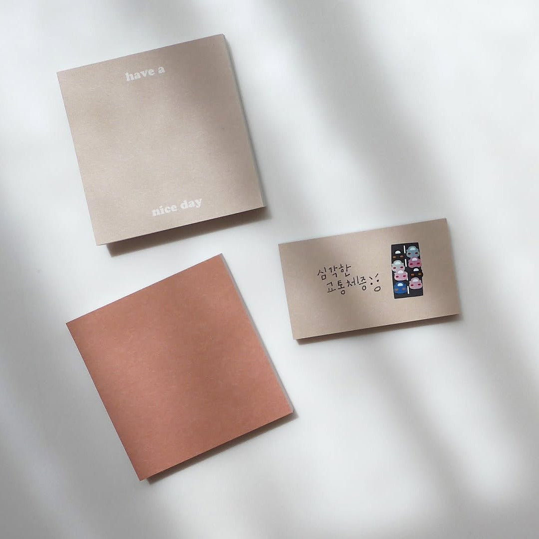 Three notebooks with different designs on a light background, from the City!City! Sticker Sheet