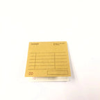 Stack of yellow receipt pads on a white background