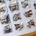 Collage of detailed sketches of buildings on a textured surface