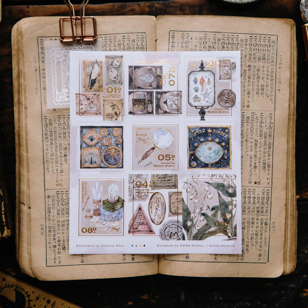 Sheet of decorative stamps on an open book with text