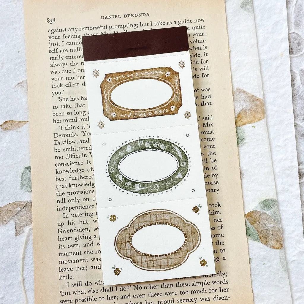 Decorative bookmarks with floral designs on an open book