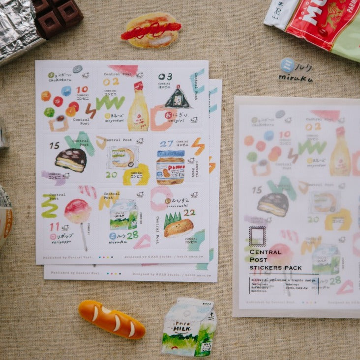 Sticker sheets with food-themed designs on a textured surface