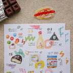 Collection of illustrated food items on a paper sheet with a hot dog and chocolate bar on a textured surface.