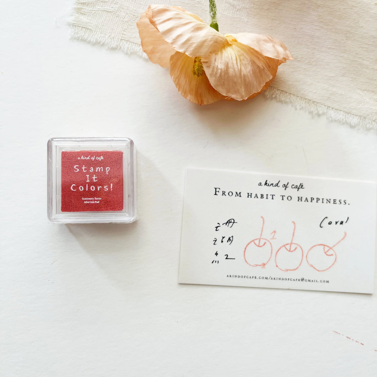 Coral Stamp Ink Pad by a kind of café — coral-red pigment ink pad with cherry-print card, for journaling