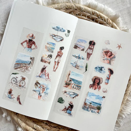 Two sheets of Coastal Living PET Tape seaside illustrations laid together on a woven texture
