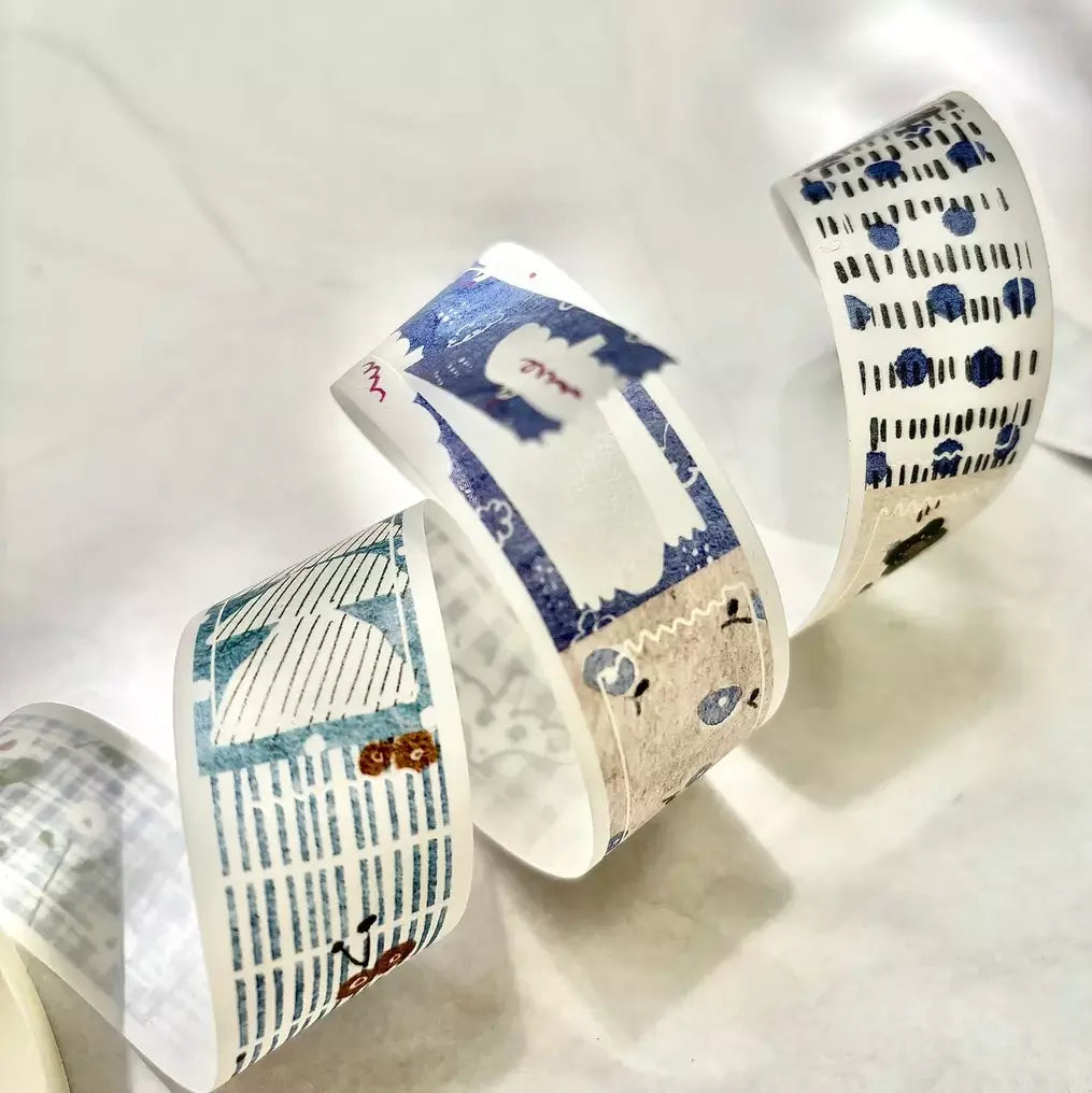 Three rolls of decorative tape with unique patterns on a light background