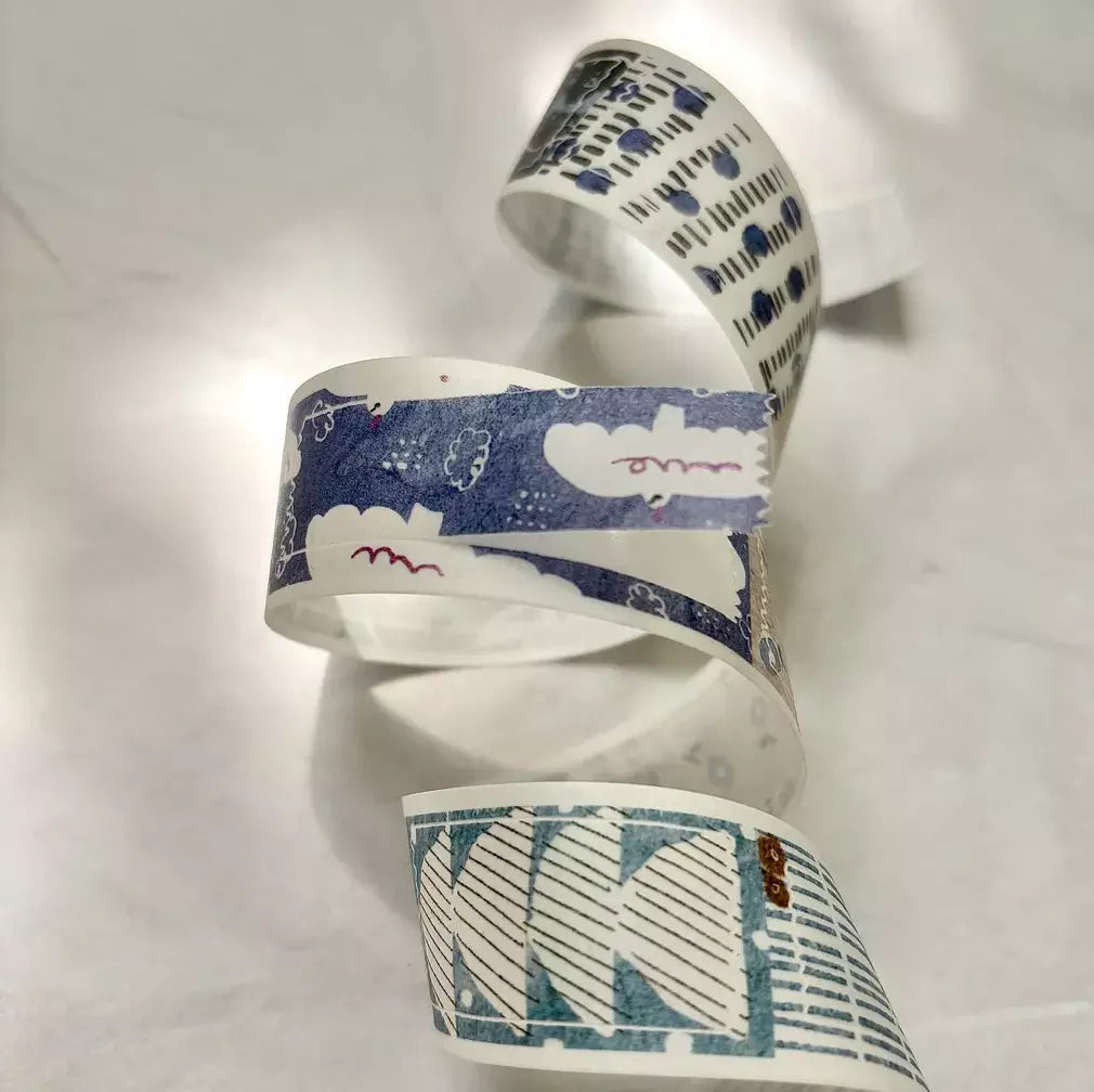 Rolls of Cut-Out Washi Tape showing their varied patterns on a white background, detail view