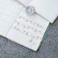 A Pair of Red Shoes Washi Tape by Dodolulu — cartoon-duck washi tape in an open planner, for journaling