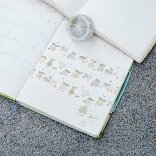 A Pair of Red Shoes Washi Tape by Dodolulu — cartoon-duck washi tape in an open planner, for journaling