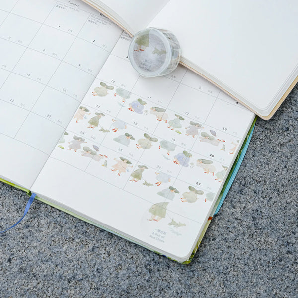 A Pair of Red Shoes Washi Tape by Dodolulu — cartoon-duck washi tape in an open planner, for journaling