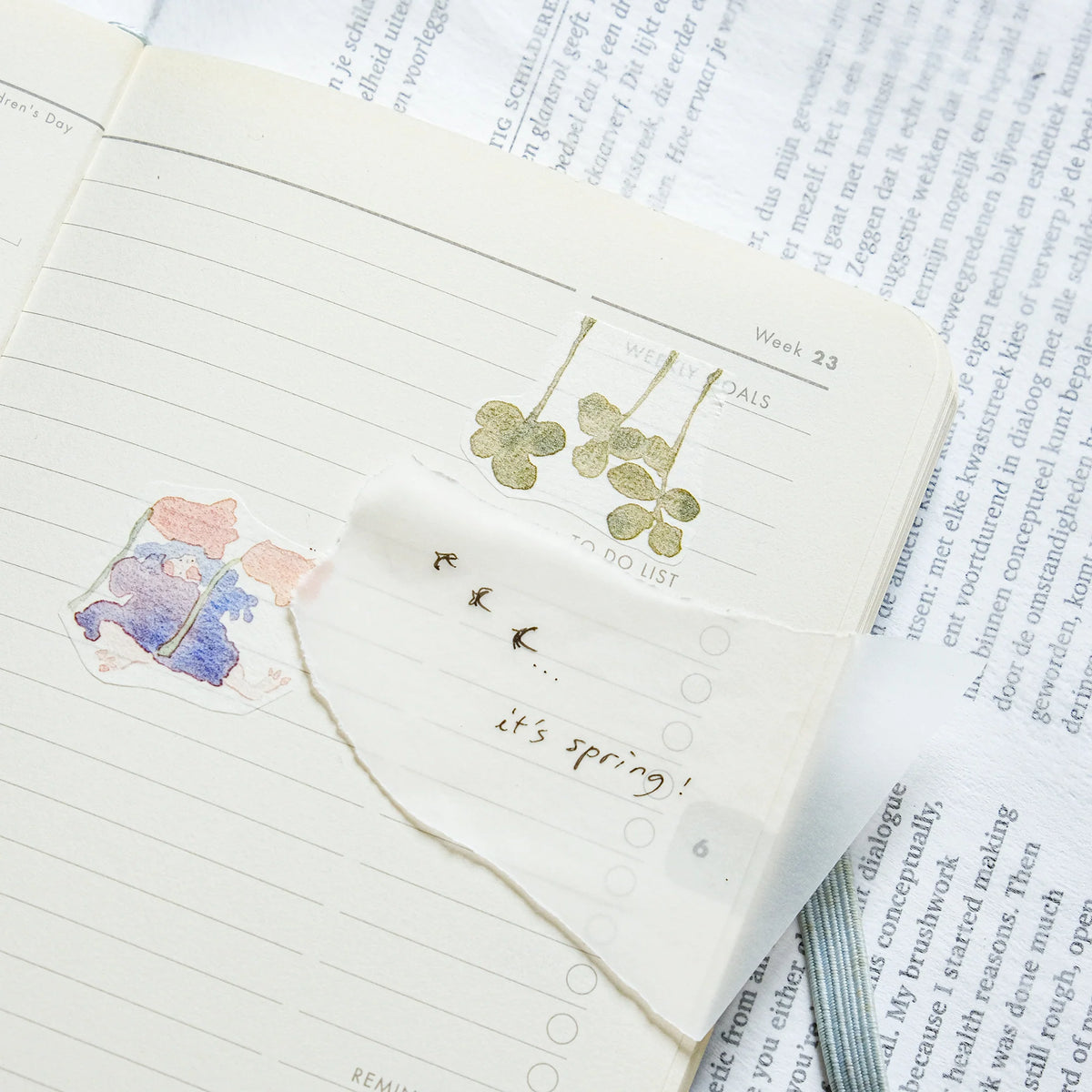 Memories Washi Tape by Dodolulu — clover earrings on an 'it's spring!' note, styled shot, for journaling
