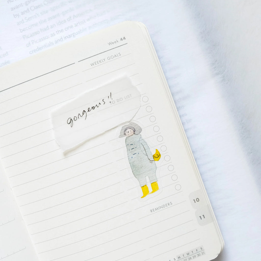 Passers-By Sticker Set by Dodolulu — coat-and-boots figure sticker in a notebook, for journaling