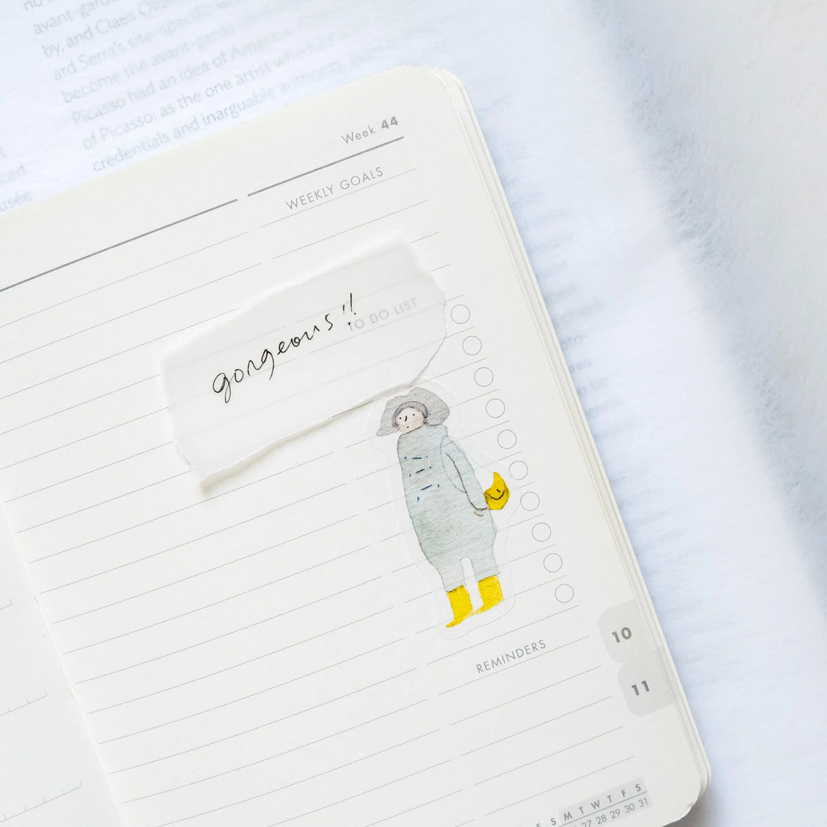 Passers-By Sticker Set by Dodolulu — coat-and-boots figure sticker in a notebook, for journaling