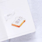 Magic Recipe Sticker Set by Dodolulu — cat-on-toast design shown on a magazine page, for journaling