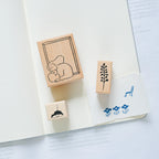 By The Window Rubber Stamp by Dodolulu — rubber stamps on a notebook page, for journaling