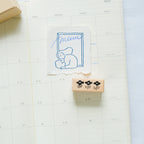 By The Window Rubber Stamp by Dodolulu — bear-holding-menu stamped design in a calendar, for journaling