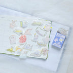 Beyond Imagination Sticker Set by Dodolulu — clear cartoon stickers on a notebook with box, for journaling