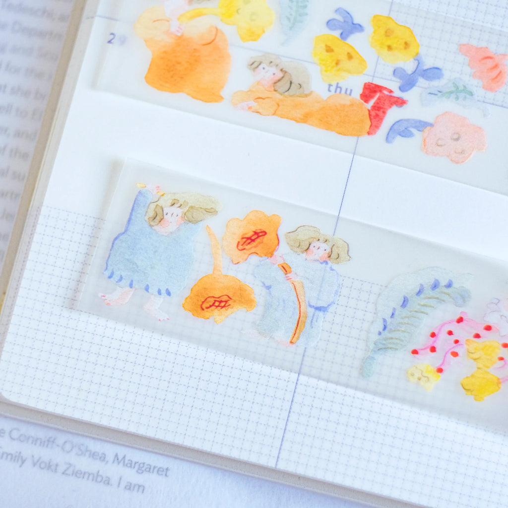 Indulgence PET Tape by Dodolulu — cartoon-character PET tape on a notebook page, for journaling