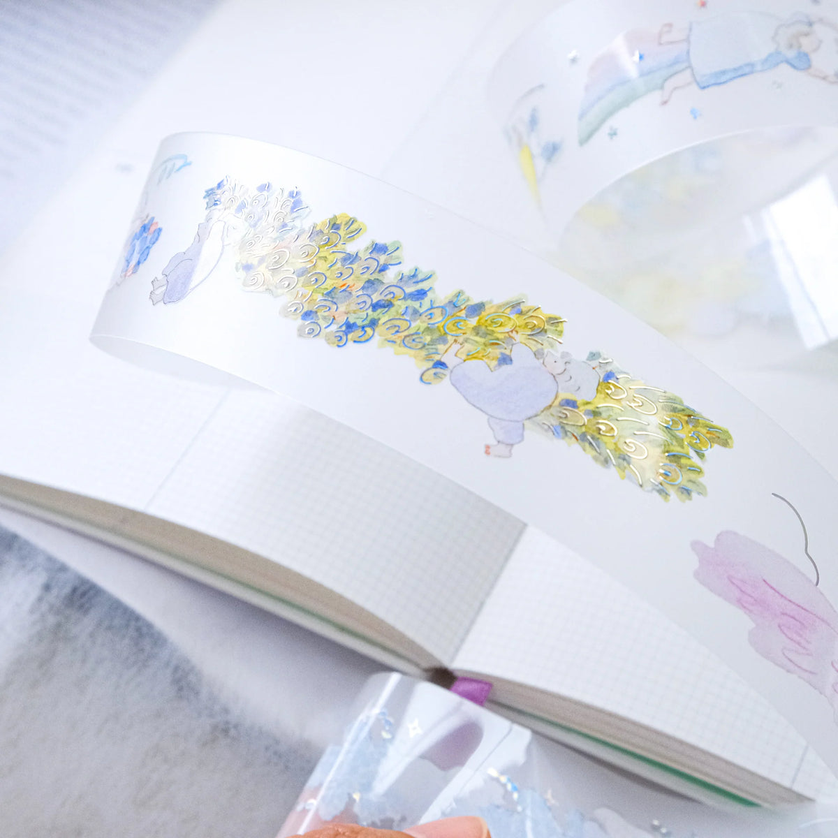 Holiday Essence PET Tape by Dodolulu — festive PET tape in an open book, for journaling
