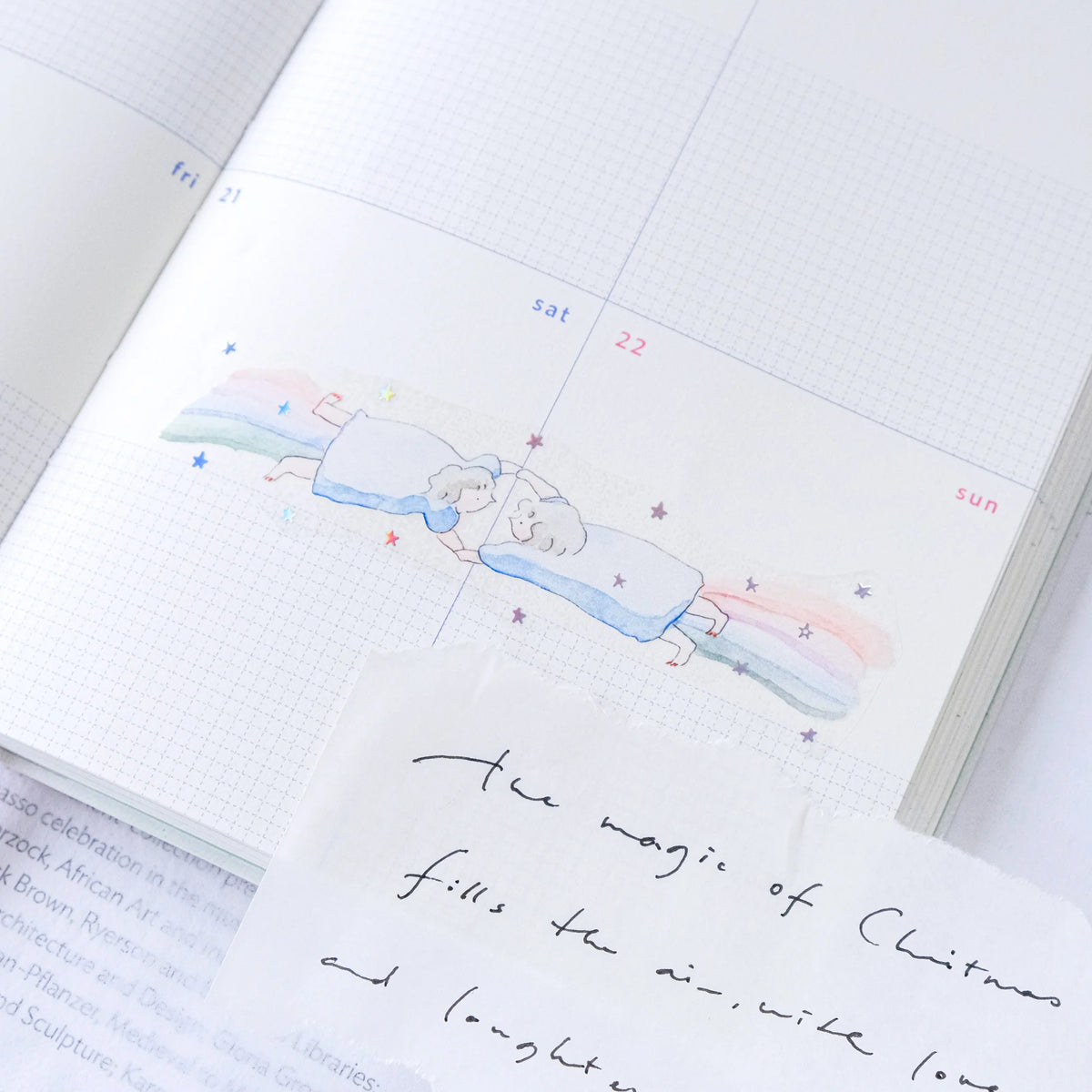 Holiday Essence PET Tape by Dodolulu — Christmas-themed PET tape in a notebook, for journaling