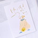 Buy The Bag Greeting Card by Dodolulu — figure-with-bag quote card shown on white, for gifting