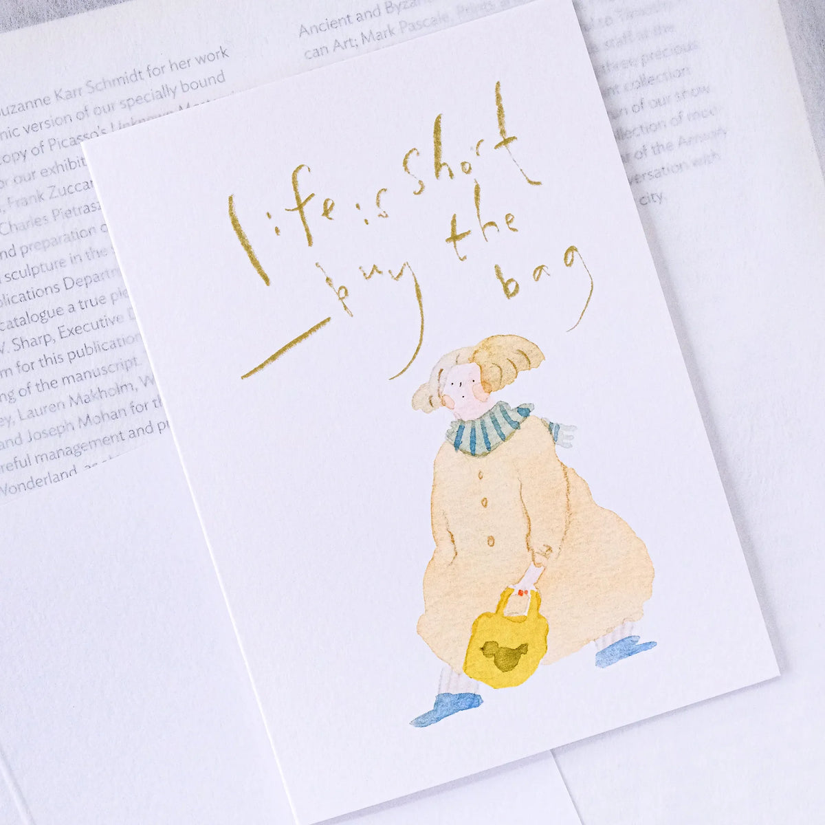 Buy The Bag Greeting Card by Dodolulu — figure-with-bag quote card shown on white, for gifting