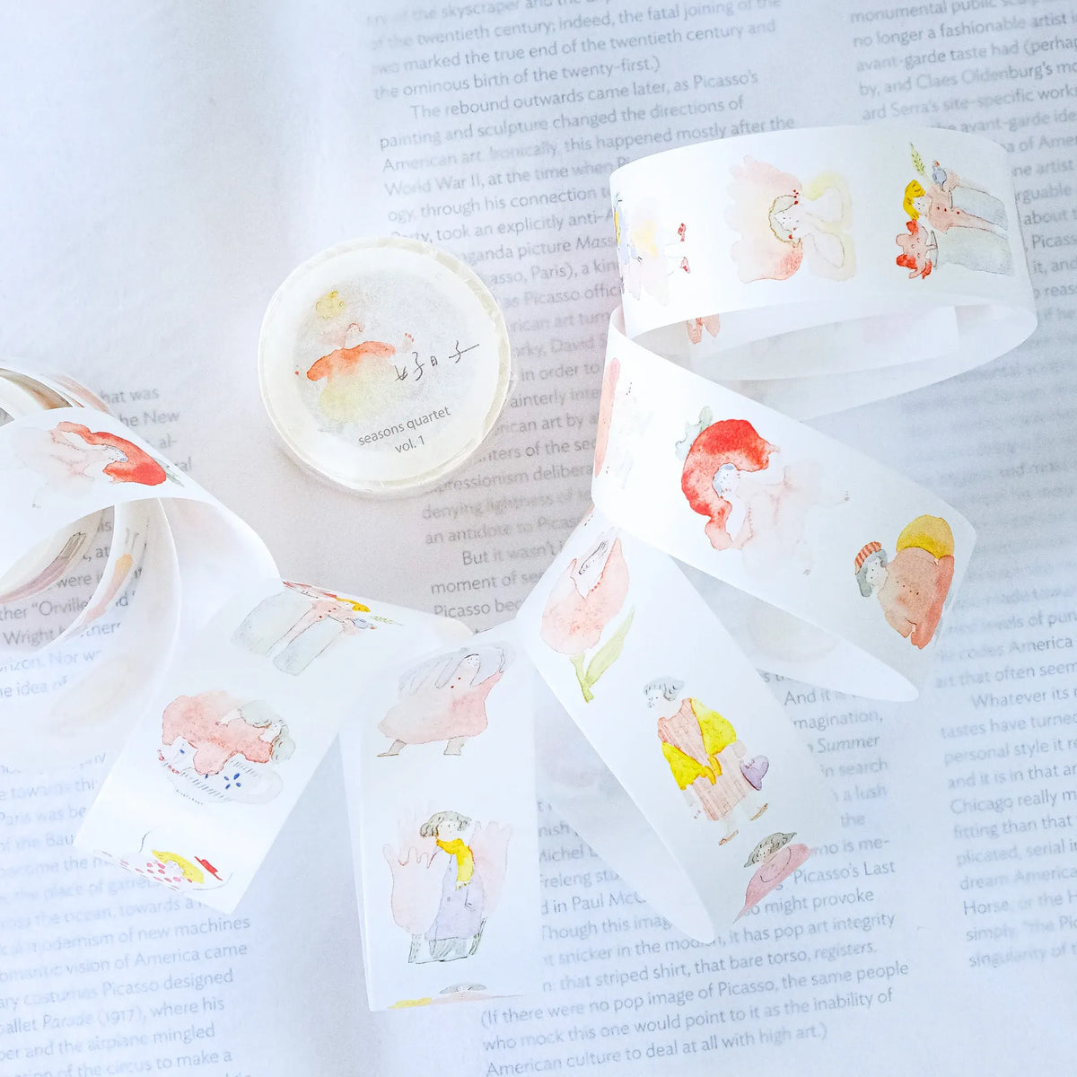 Seasons Quartet Vol.1 Washi Tape by Dodolulu — cartoon-character washi tape on a book page, for journaling