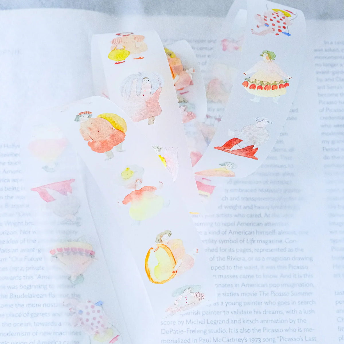 Seasons Quartet Vol.1 PET Tape by Dodolulu — character PET tape roll on a book page, for journaling