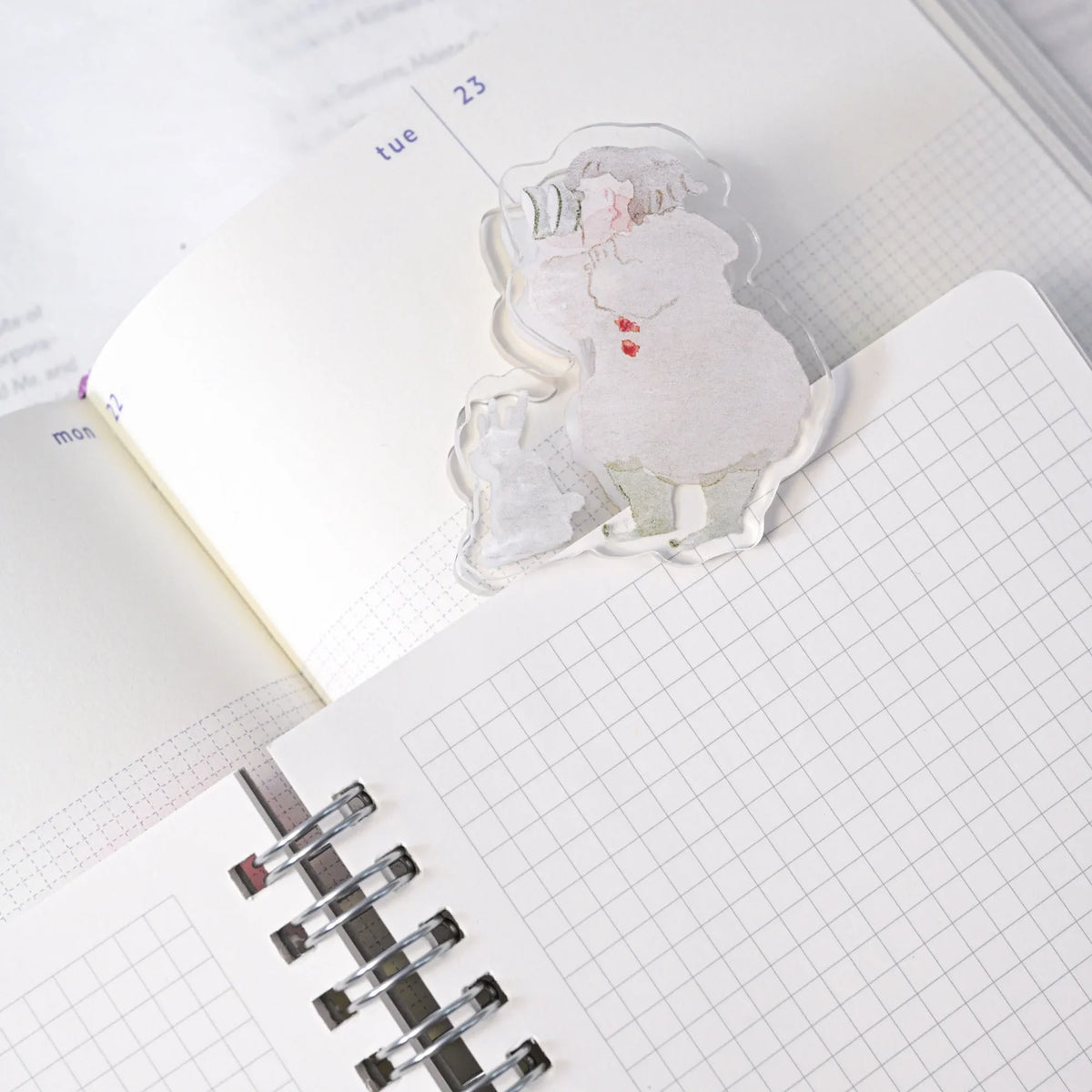 Telescope Journaling Clip by Dodolulu — acrylic Santa-illustration clip on grid notebooks, for journaling