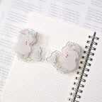 Telescope Journaling Clip by Dodolulu — two acrylic winter-scene clips on a grid notebook, for journaling
