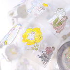 Nestled In Green .doremi. PET Tape by Dodolulu — bunny, cat and flower PET tape roll close-up, for journaling