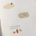 Decorative stationery items on a textured white surface