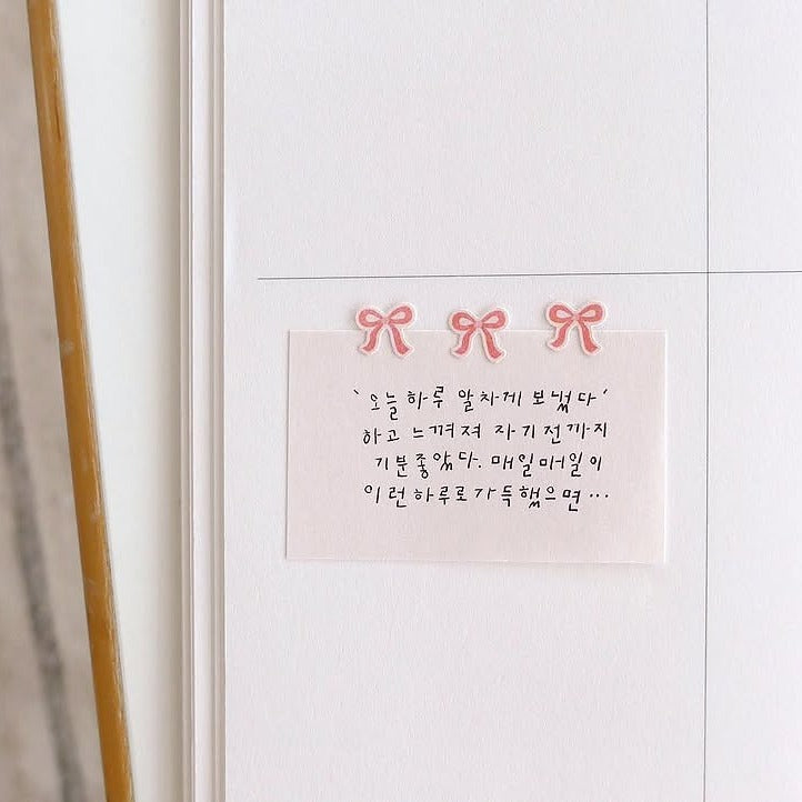 Note with Korean text and decorative bows on a white refrigerator, from the Deco 13 Sticker Sheet