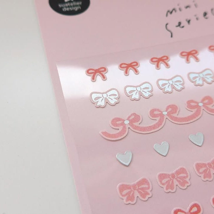 Stickers with pink and white bows on a pink background, from the Deco 13 Sticker Sheet