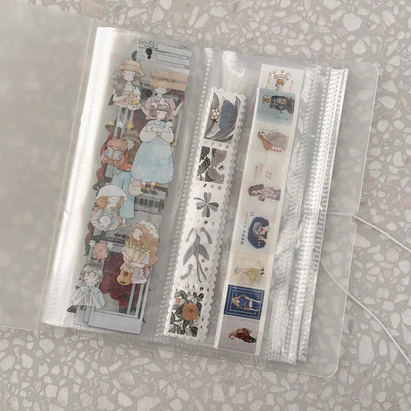 Set of decorative paper strips in a clear plastic case on a textured surface