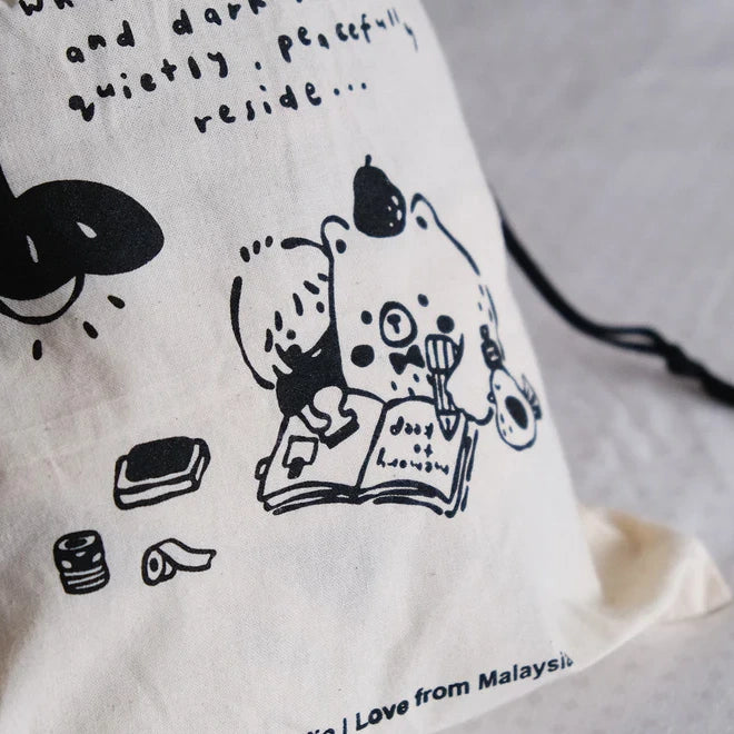 One Stamp at a Time Drawstring Pouch laid flat showing its black illustrations on light grey