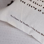 Textured fabric with printed text including 'By Eileen Tai Studio' and 'Love from Ma', on a light gray background.